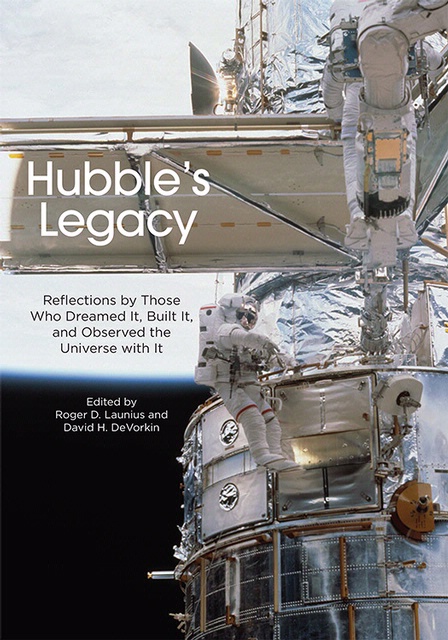 Book cover featuring a partial view of the Hubble Space Telescope in orbit as an astronaut performs a spacewalk next to the telescope. The book title "Hubble's Legacy" is placed on a solar panel that is perpendicular to the rest of the visible telescope.