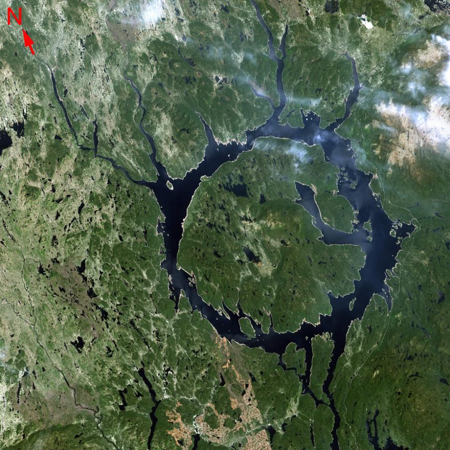 Satellite image of a ring shaped lake known as the Manicouagan Reservoir.  