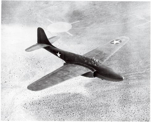 Painted with U.S. Air Force markings, the Bell XP-59A Airacomet flies over California’s Mojave Desert in October 1944. The Airacomet was the first American jet aircraft.