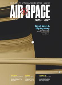 Magazine cover showing a close up of Saturn and it's small moon Enceladus. The title of the magazine is Air & Space Quarterly. 