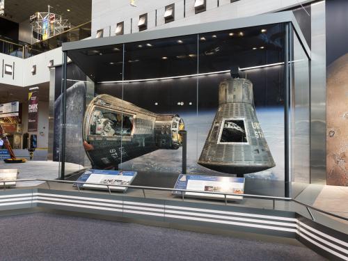 Mercury Friendship 7 and Gemini IV on display in the Boeing Milestones of Flight Hall