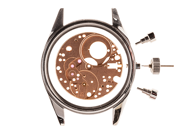A final copper protective plate sits on top of the watch face with an outer silver rim and bolts holding the watch together.