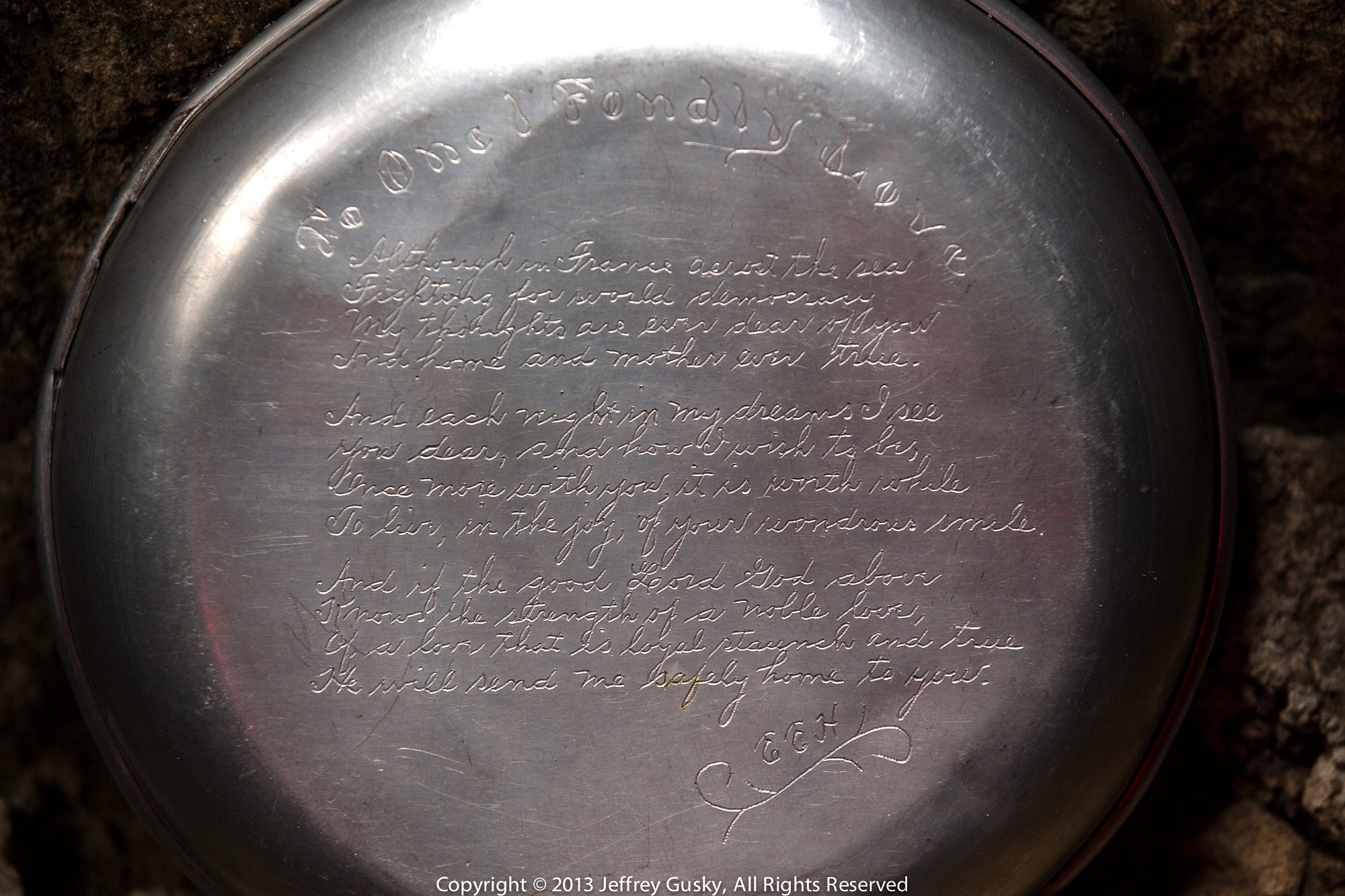 Close up of an engraved mess kit. 