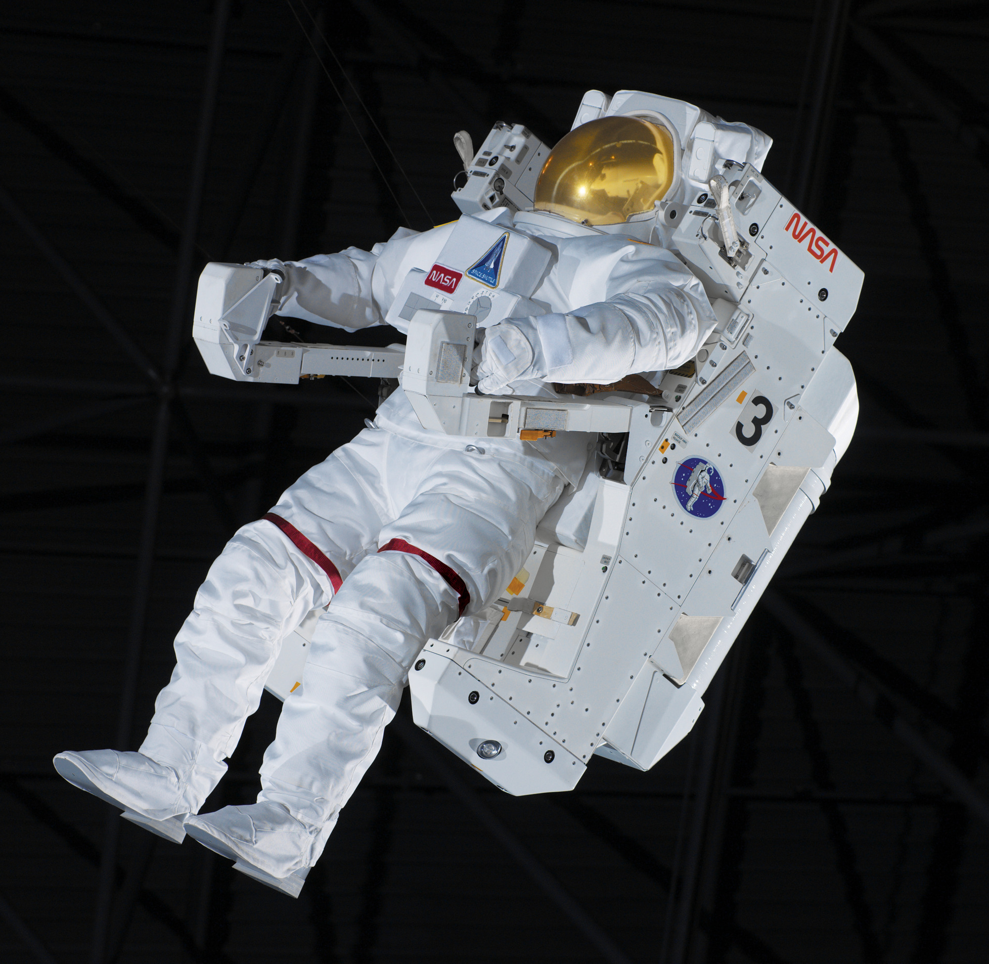 View of the front of a spacesuit. The suit has a propulsion backpack attached to it.