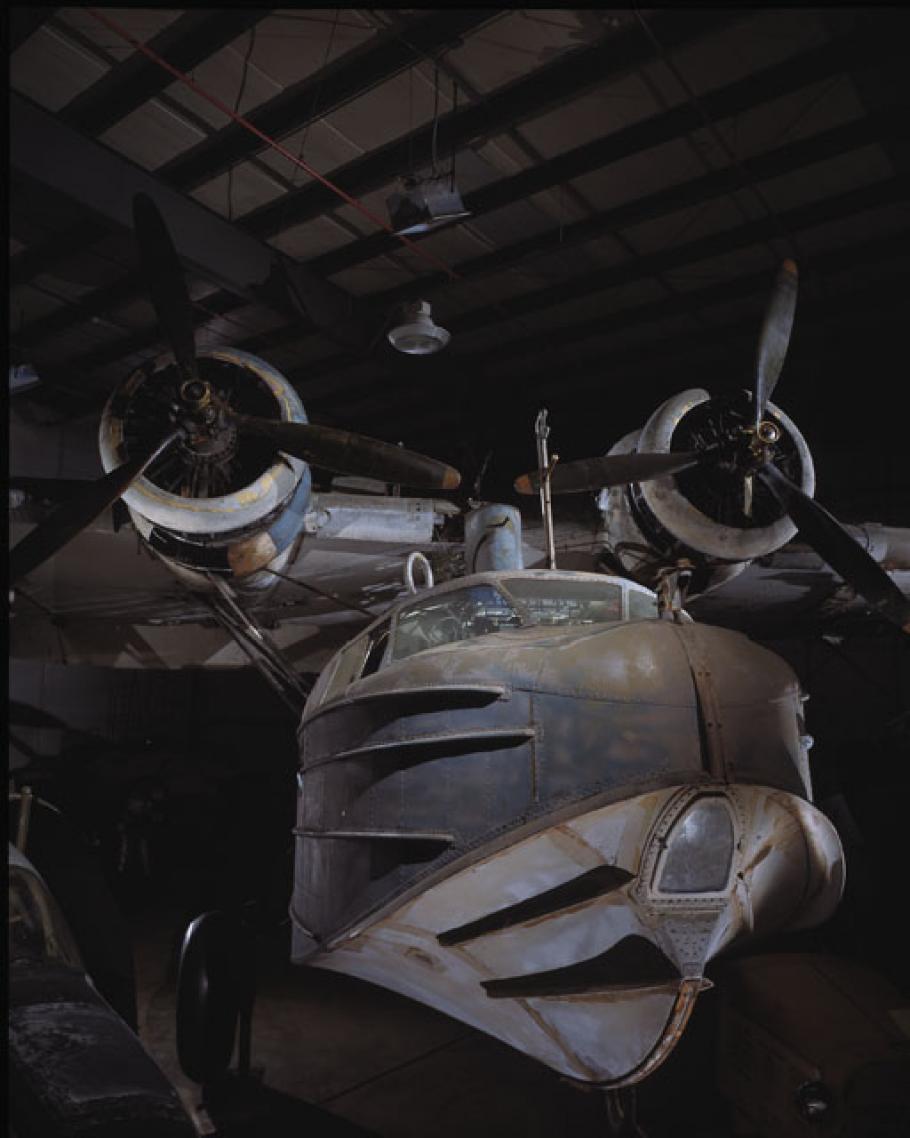 Dramatic photo of the Sikorsky JRS-1 in a hangar. 