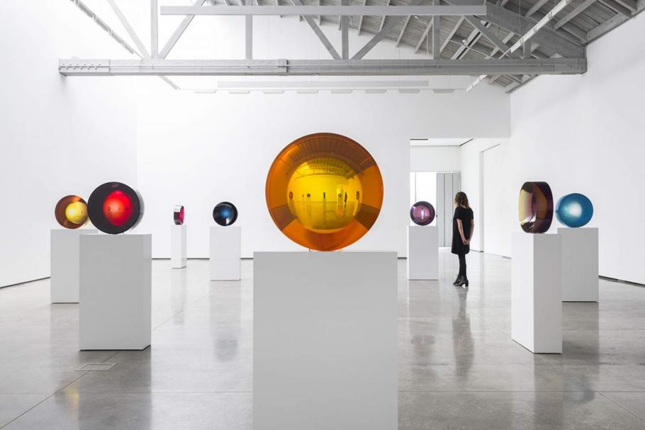 Spherical glass art in a gallery.