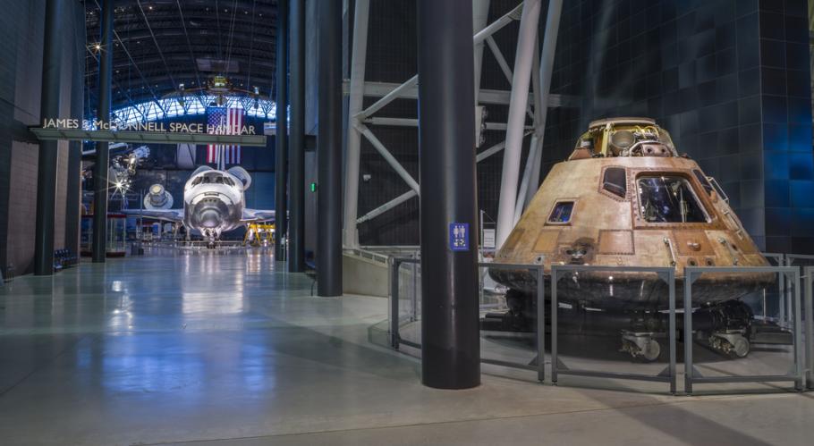 The Space Shuttle Discovery and Apollo 11 command module Columbia are both on display at the Steven F. Udvar-Hazy Center in this photograph.