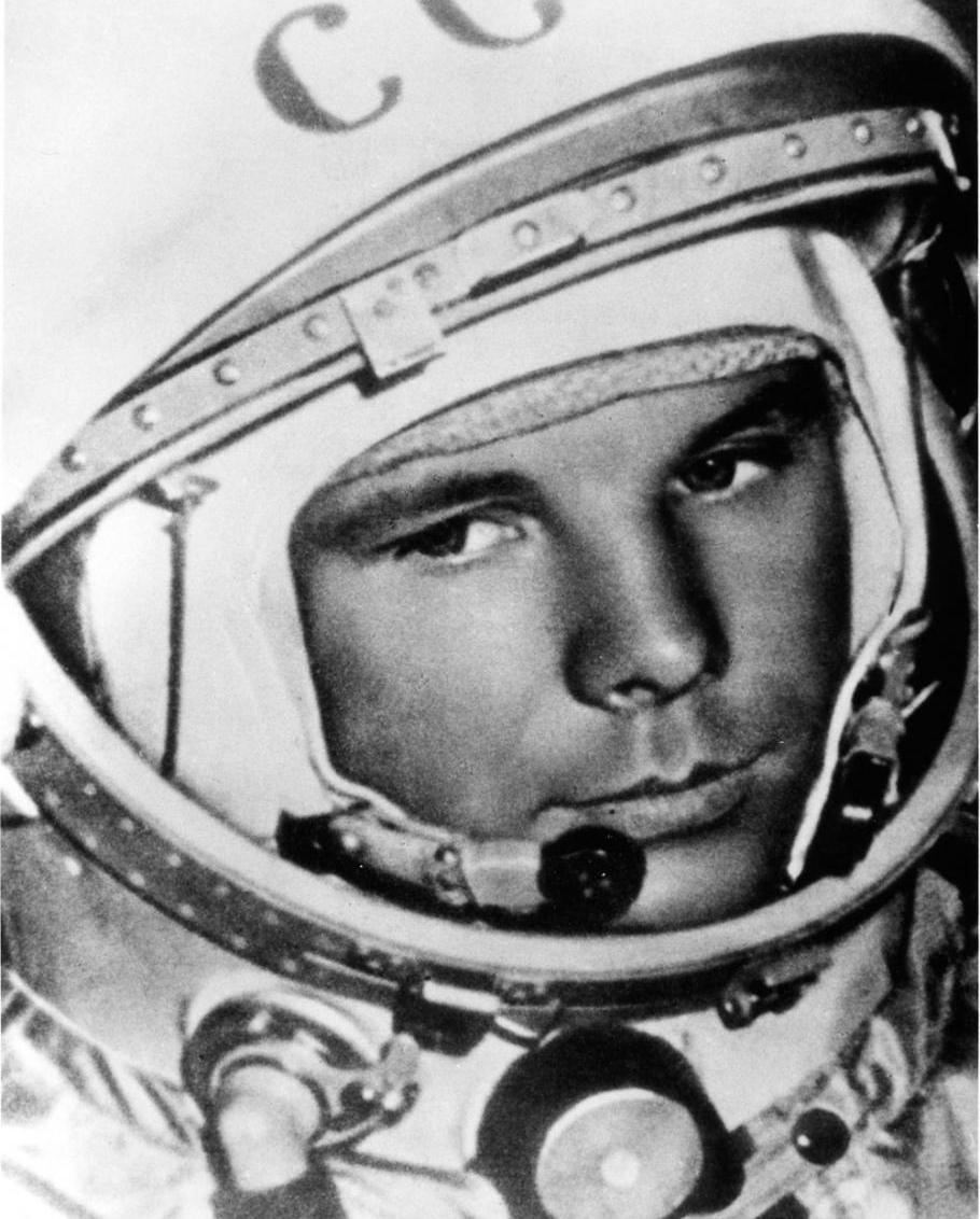 A black and white photograph of Yuri Gagarin. 