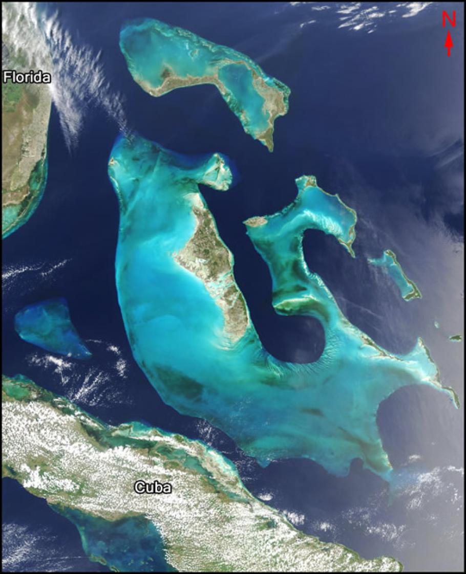 Satellite image of a group of islands. Florida is to the west of the islands and Cuba is to the South.
