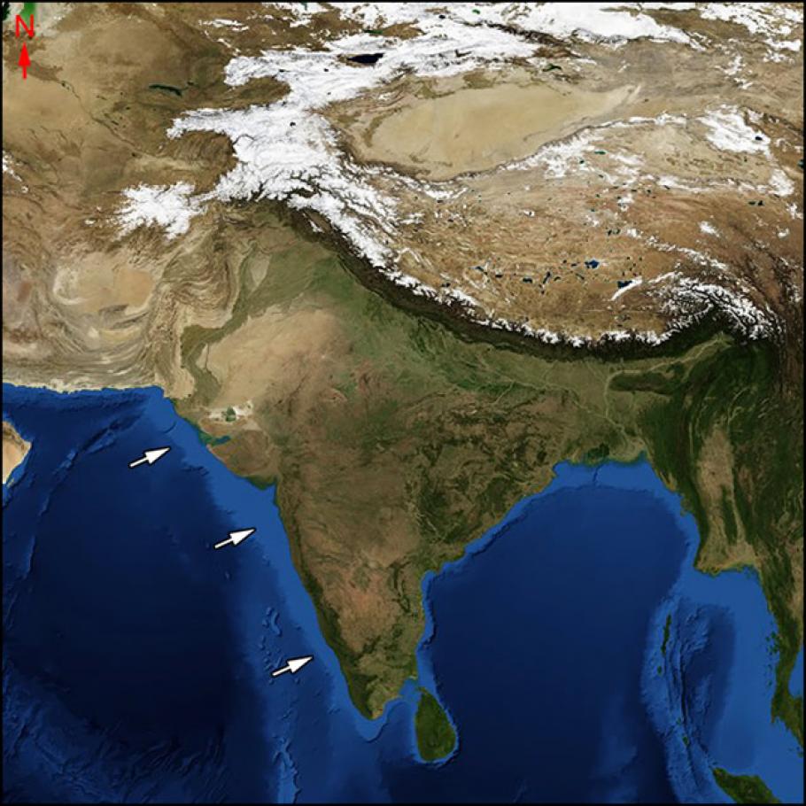 White arrows point to a country south of the Himalayas in a satellite image of both.