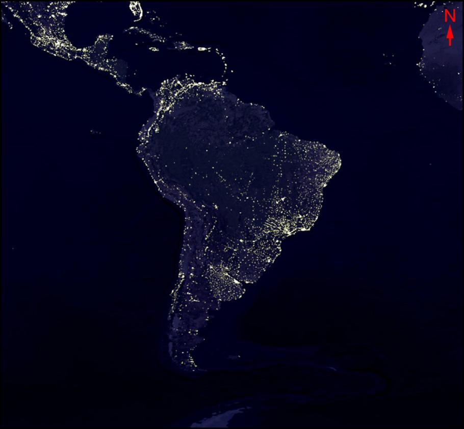 Satellite image of South America at night. Large cities are identifiable by the light they produce.