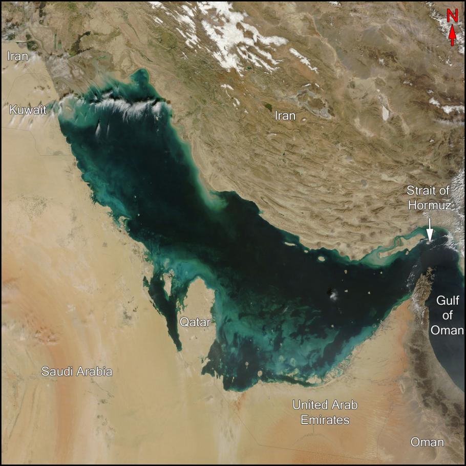 Satellite image of a body of water surrounded by Saudi Arabia, Qatar, Kuwait, Iran, the Strait of Hormuz, the Gulf of Oman, Oman, and United Arab Emirates.