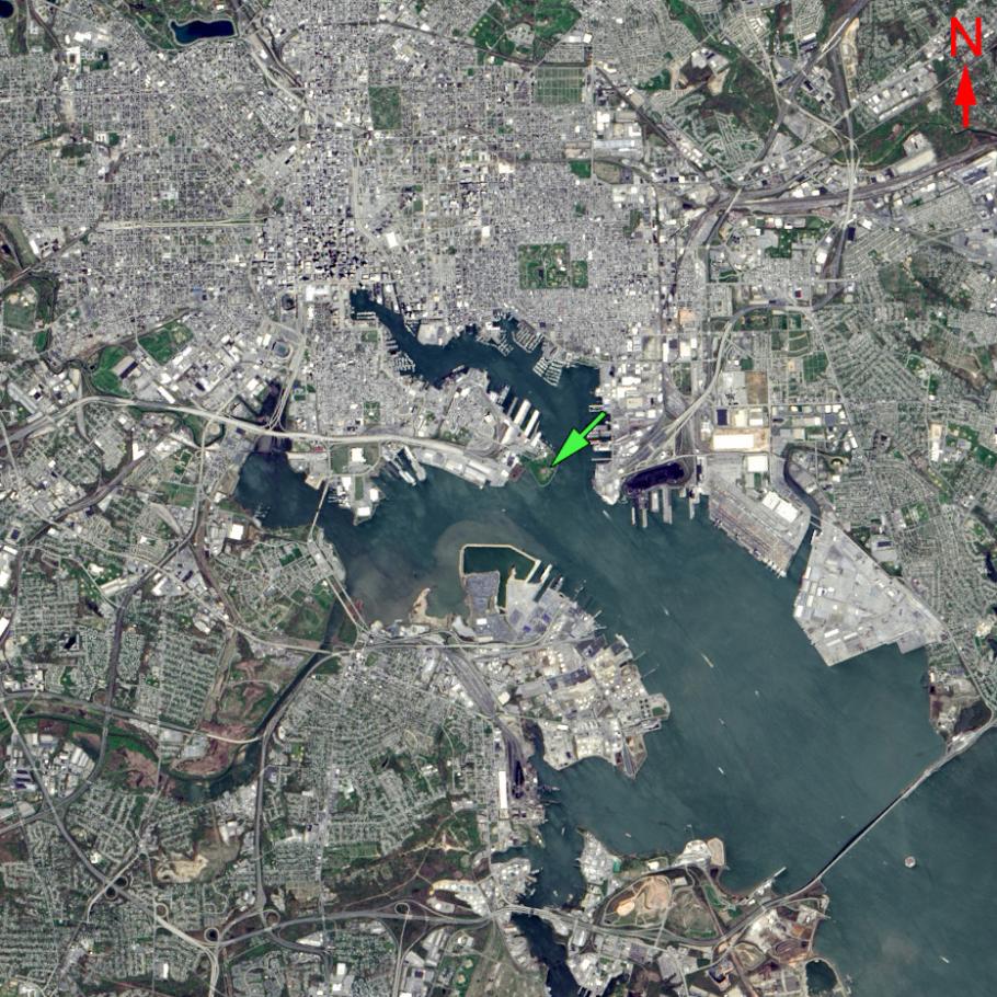 Satellite image of a harbor that is surrounded by a city. 