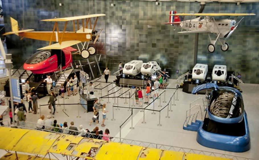 A view from above shows visitors waiting in line for simulators at the Steven F. Udvar-Hazy Center.