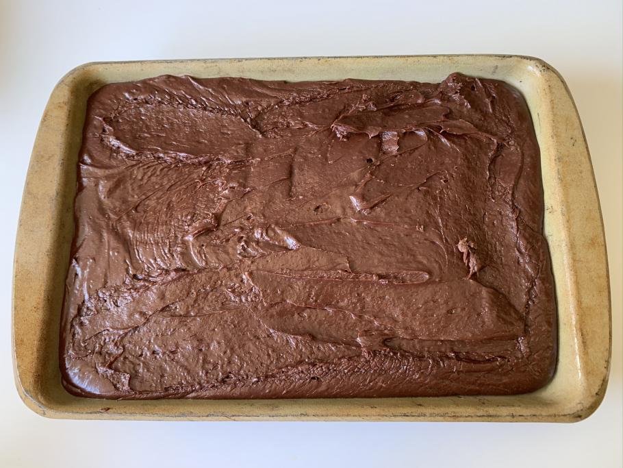Block of fudge in a tan baking sheet