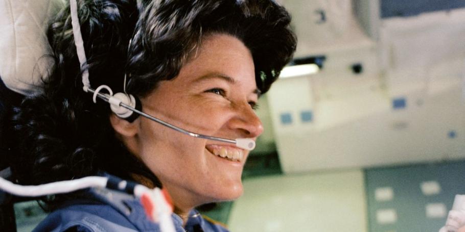 Sally Ride in astronaut flight suit and headset 