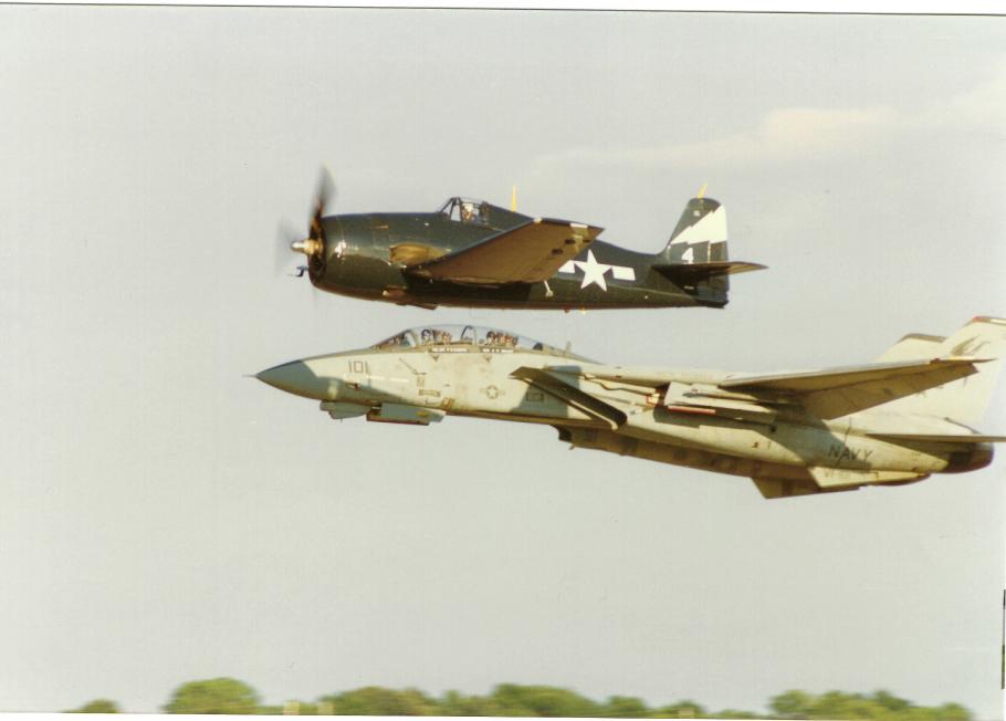 An F-14 Tomcat and F6F Hellcat flying in formation