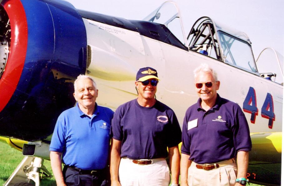 [left to right] Don Lopez, Dale Snodgrass, and Jack Dailey standing next to an aircraft