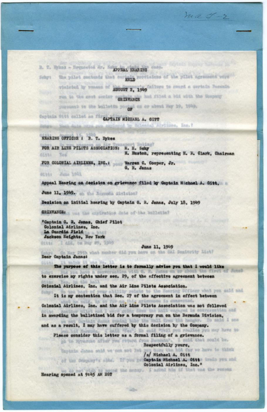 Page of typewritten text on onionskin on blue paper background