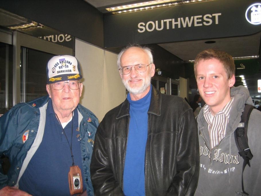 Glenn Lane, Jim Zimbelman and a young man posing for a picture that captures them from the waist up.