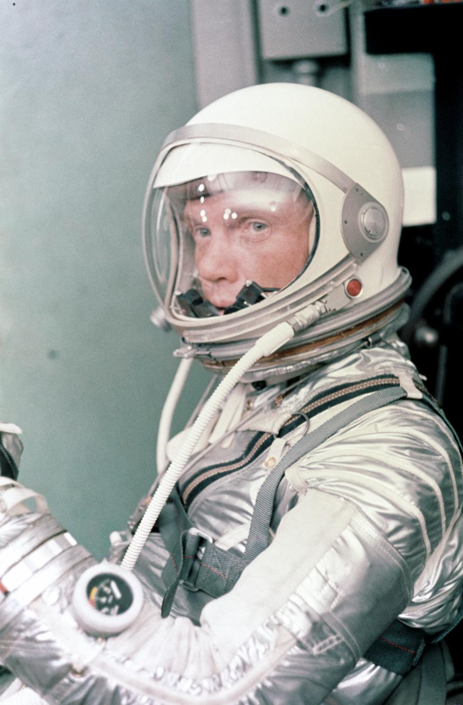 John Glenn dons his silver Mercury pressure suit in preparation for launch.