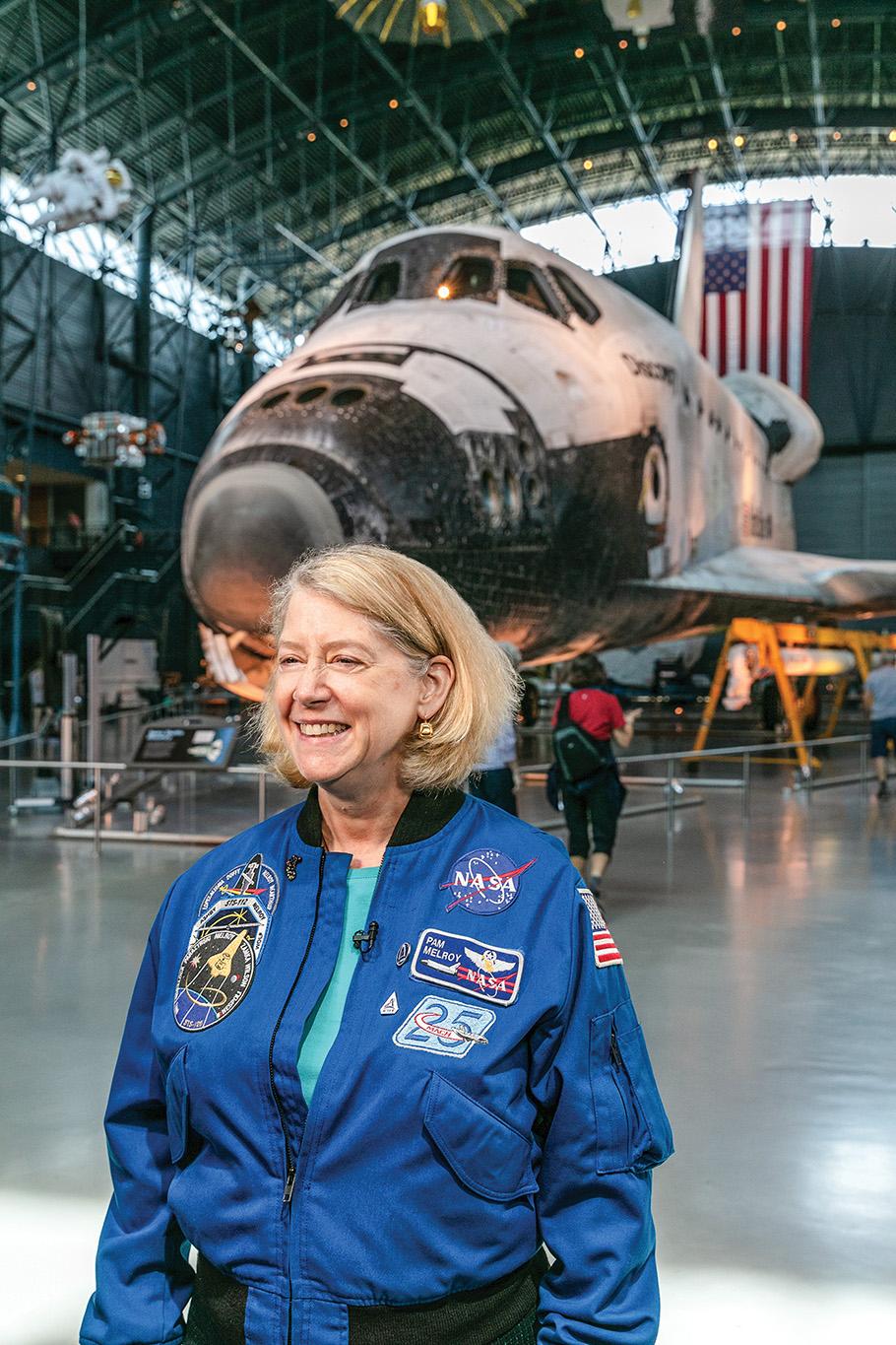 Interior portrait astronaut Pamela Melroy visiting Space Shuttle Discovery
