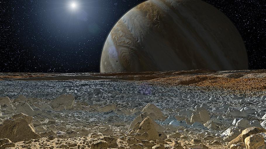 illustration of Europa's rocky landscape with Jupiter and the distant sun