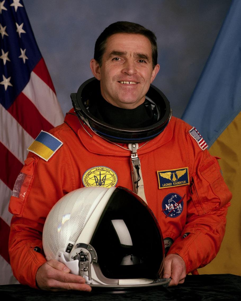 man in orange astronaut flight suit