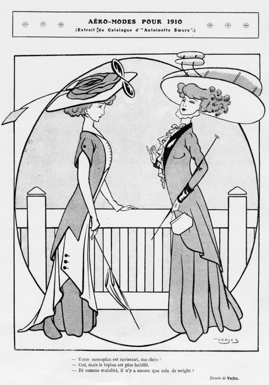 Two women stand facing each other. Both are fashionably dressed in long dresses and large hats. The hat on the right resembles a Wright-type biplane.
