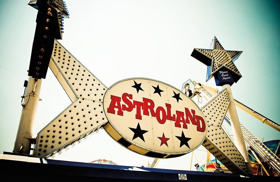 A large sign, festooned with stars and lightbulbs, bears a single word, ASTROLAND, and beckons visitors to step inside the futuristic amusement park in Coney Island.