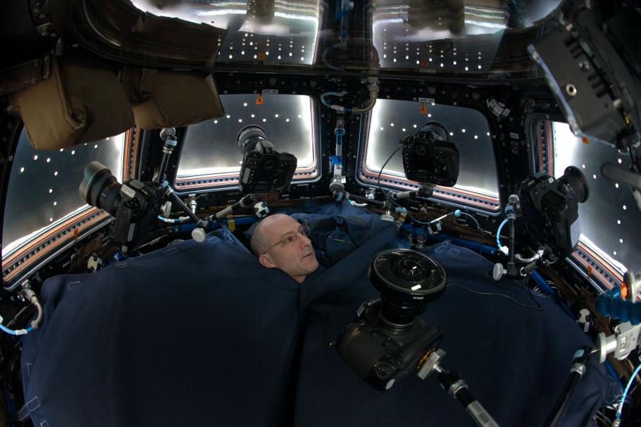 An astronaut in the cupola on the International Space Station.