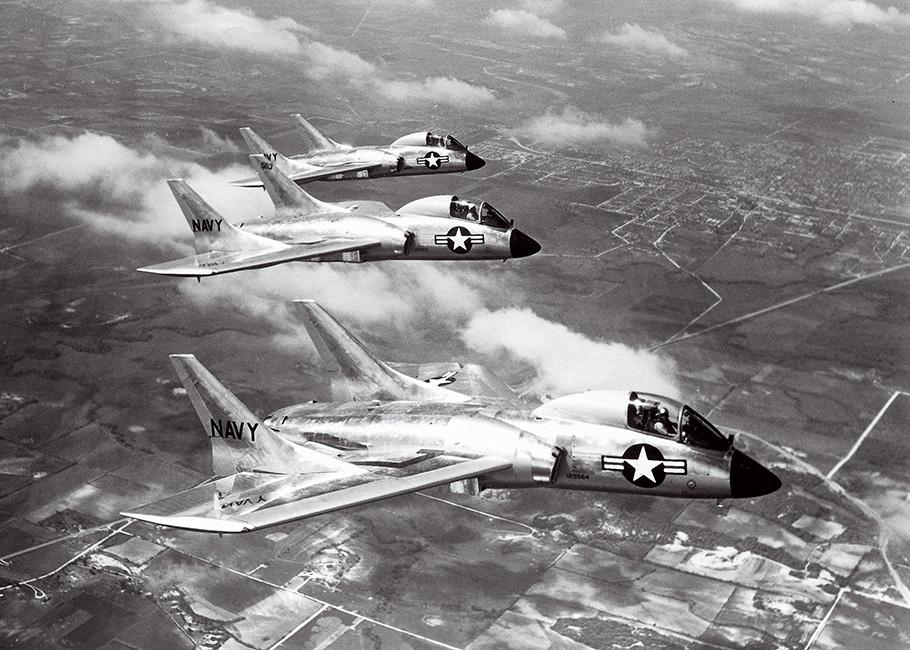 Three Cutlass F7U Navy fighters fly in a tight formation.