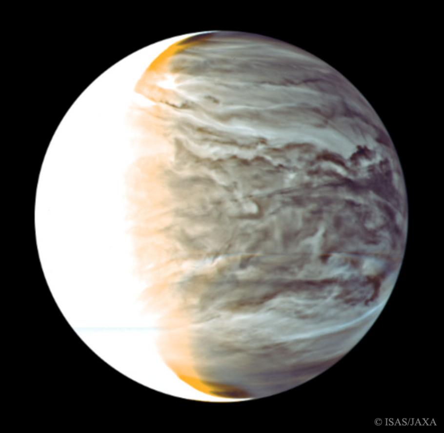 A picture of Venus from space. Its surface features swirling clouds and the left 1/4 is covered by what looks like a bright white light.