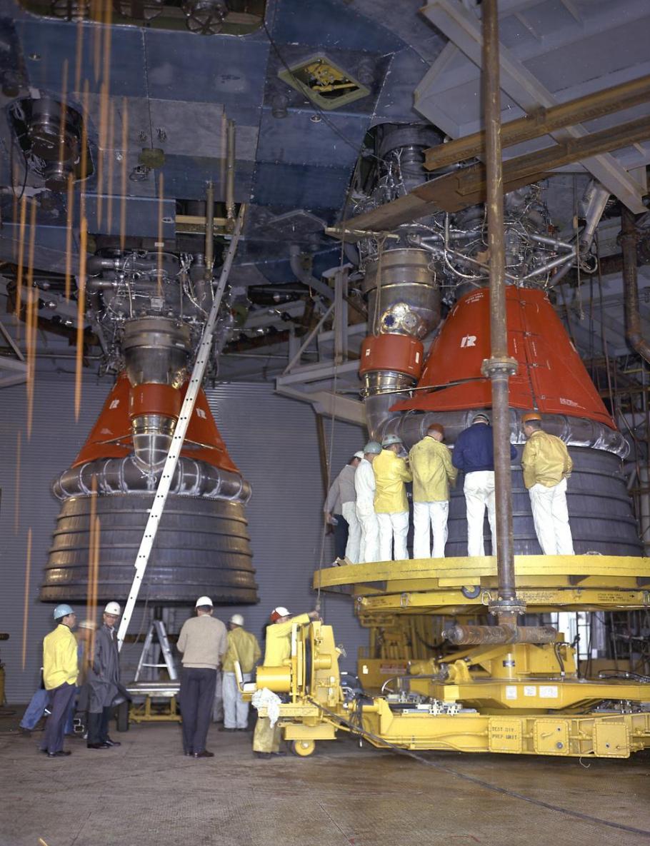 Engineers installing F-1 engines on the static test stand at Marshall Space Flight Center. (NASA)
