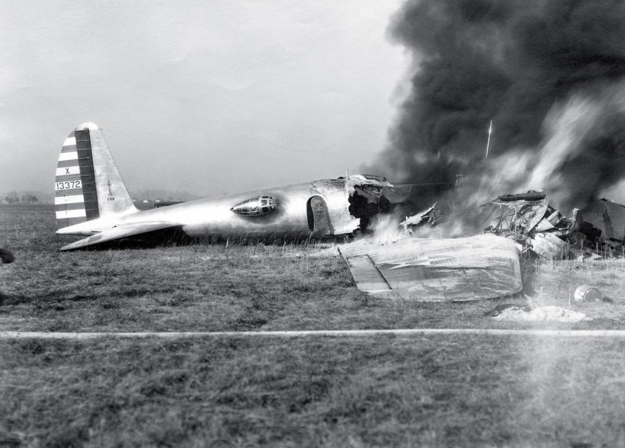 A crashed aircraft lies in the runway of Wright Field in Dayton, Ohio—the front half burning and billowing smoke. The tragic crash of Model 299 in 1935 revealed the challenges of flying increasingly sophisticated aircraft—prompting the creation of a pilot’s checklist.