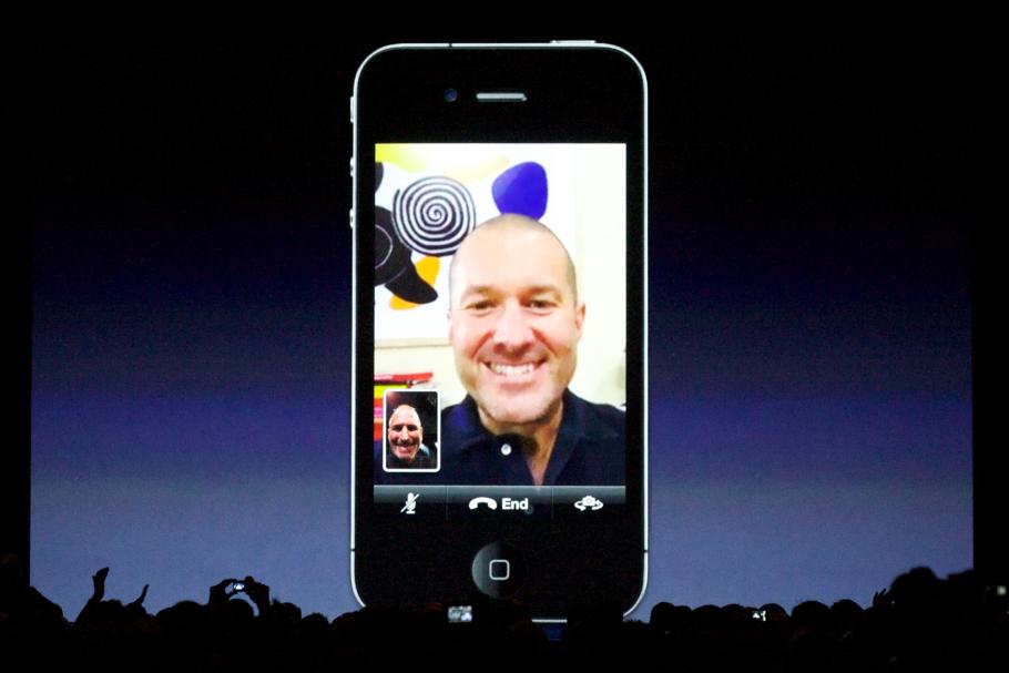 A large iPhone showing a Facetime call is projected before an audience. 