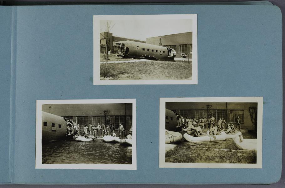 Three black and white photographs on a light blue scrapbook page. Top center photograph of an airplane fuselage. Bottom left photograph of women standing on the ground outside the fuselage. Bottom right photograph of women in boats on the ground outside the fuselage.