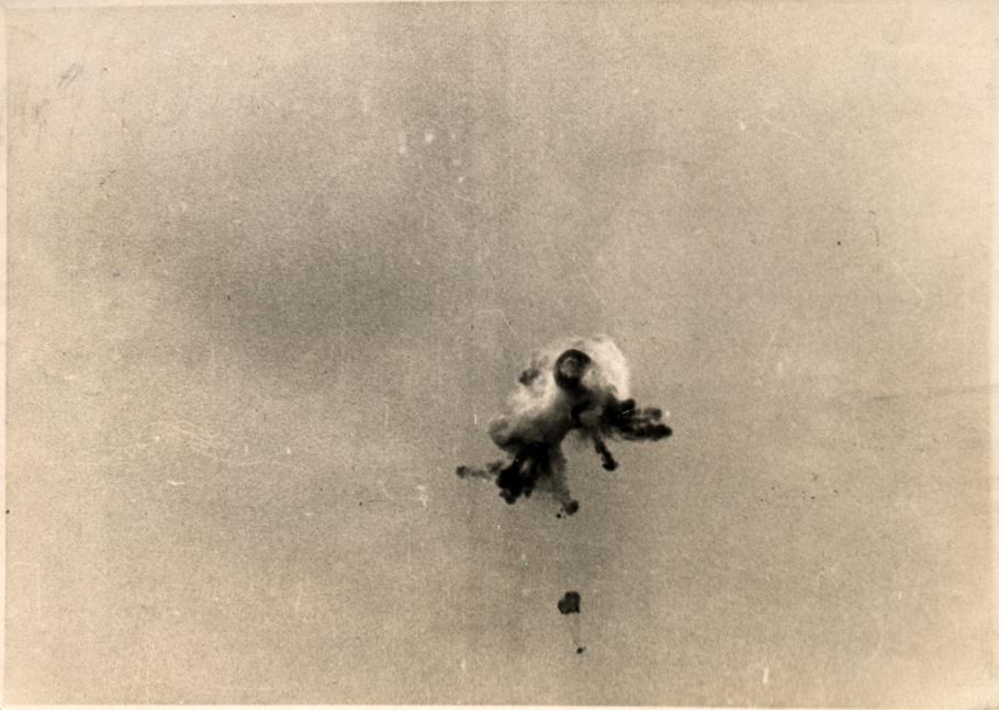 Sepia toned vintage image of view of an observation balloon being shot down. over