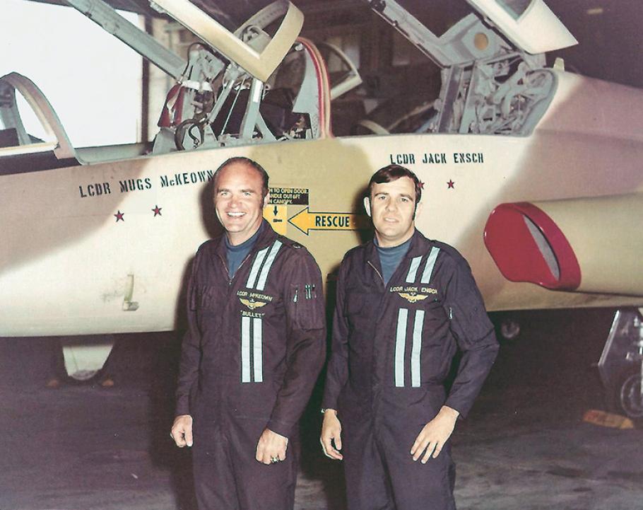 Lieutenant Commander Ronald “Mugs” McKeown and Lieutenant Commander John “Jack” Ensch stand in front of a T-38 at Top Gun after the Vietnam War. Both men were both awarded the Navy Cross for shooting down two MiGs in their F-4.