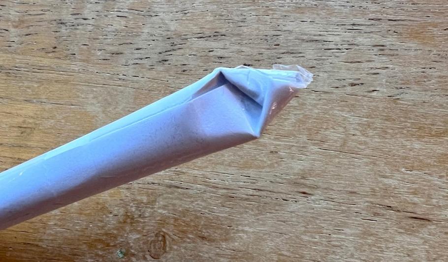 A rolled rod of paper with a pinched pointed end.