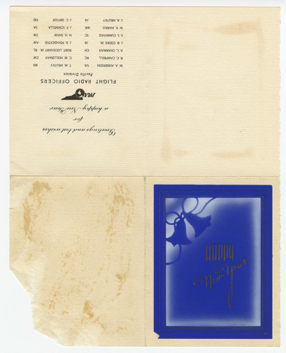 Unfolded card. Upper left corner contains upside down text with the Pan American Airways Logo. Bottom left corner contains a blue silhouette of bells and gold cursive text, "Happy New Year."