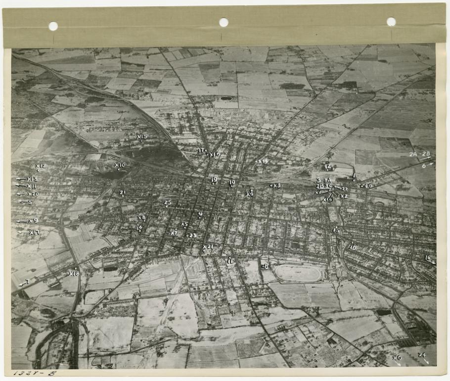 Aerial view of a town with numbers and arrows marking plant locations