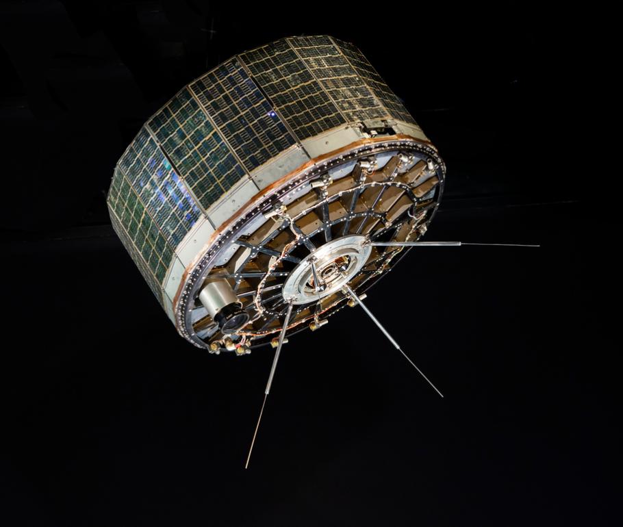 A stout cylindrical satellite with panels on the outside. 