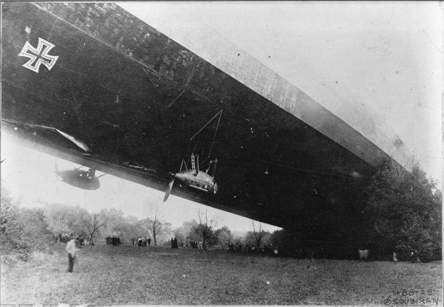 An airship with one end on the ground and the other end still floating above it.