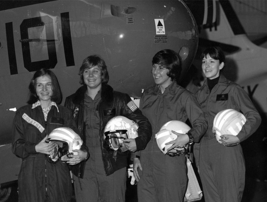 Black and white image of four women in flight suits.