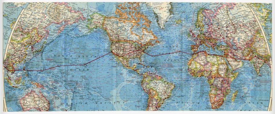 A map of the world with a flight path that travels from one end to the other.