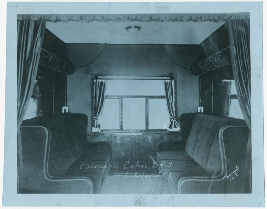 "Passenger Cabin ZR-3, Lakehurst, N.J." Interior view looking toward window of a passenger cabin on board the US Navy airship ZR-3 "Los Angeles," taken while the airship was docked at NAS Lakehurst, N.J.; circa 1923-1925. (Smithsonian National Air and Space Museum, NASM 9A19811.)