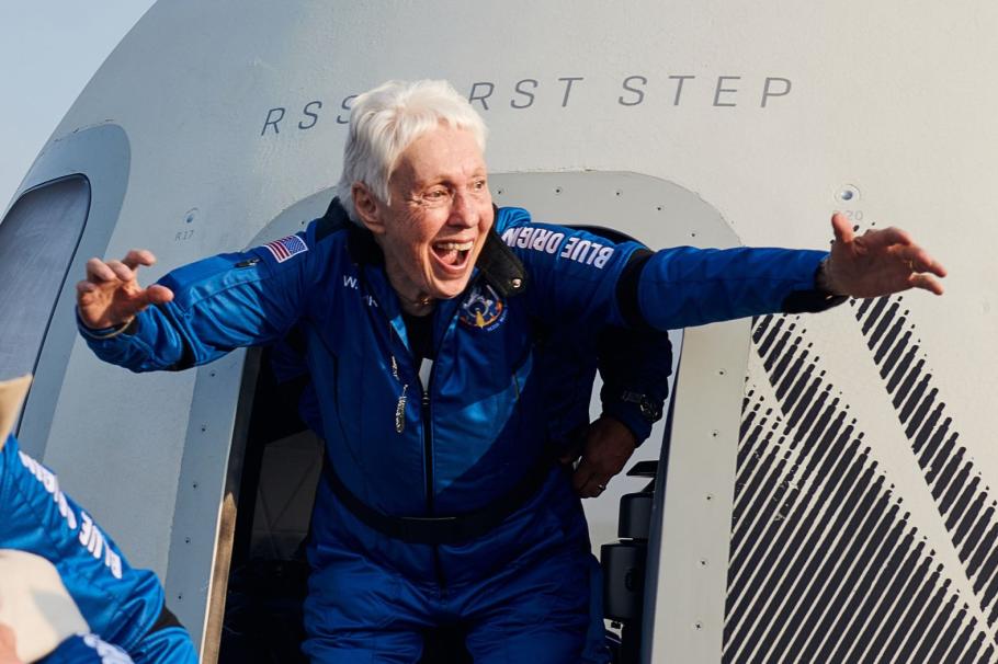 Wally Funk exits the Blue Origin capsule after becoming the oldest women to fly in space.