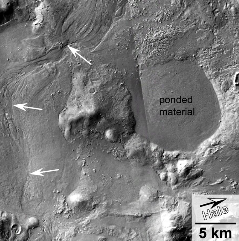 A crater on Mars with annotated texts and arrows on the image