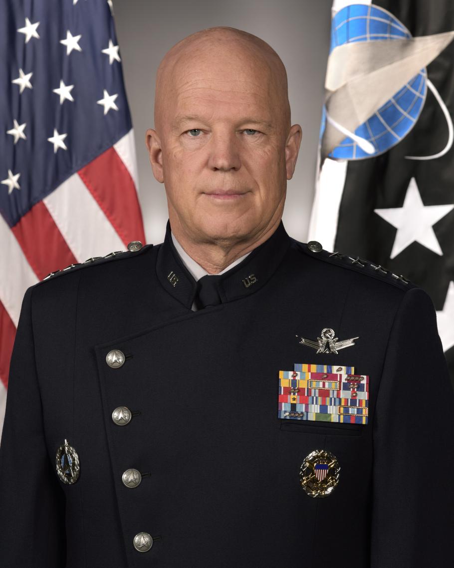 A man in military uniform poses for a portrait.